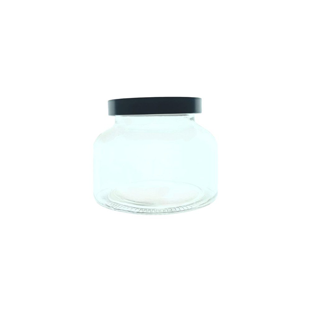 Small glass storage jar with black lid