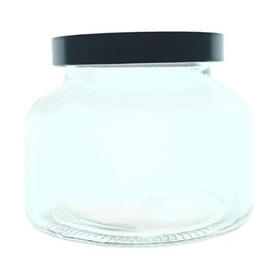 Small glass storage jar with black lid